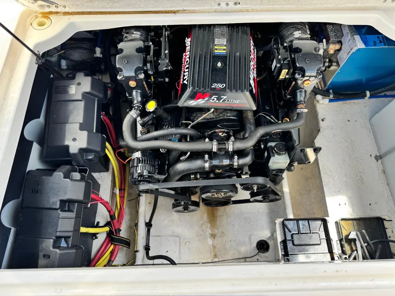 Slide: The Image of Engine compartment of a 2004 Maxum 2500 SE boat, featuring a MerCruiser 5.7L engine. - 16