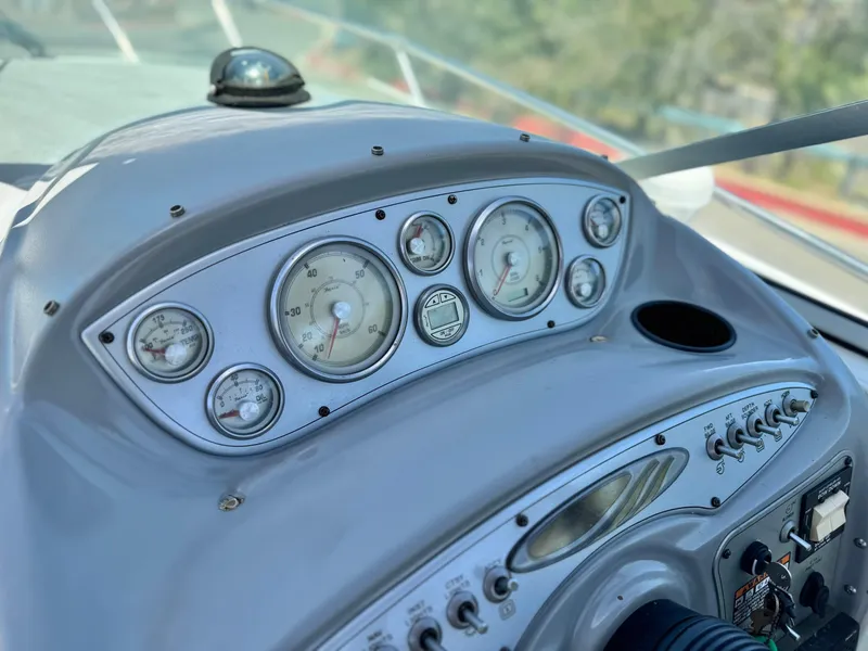 Slide: The Image of Dashboard of a 2004 Maxum 2500 SE boat with gauges and controls. - 29