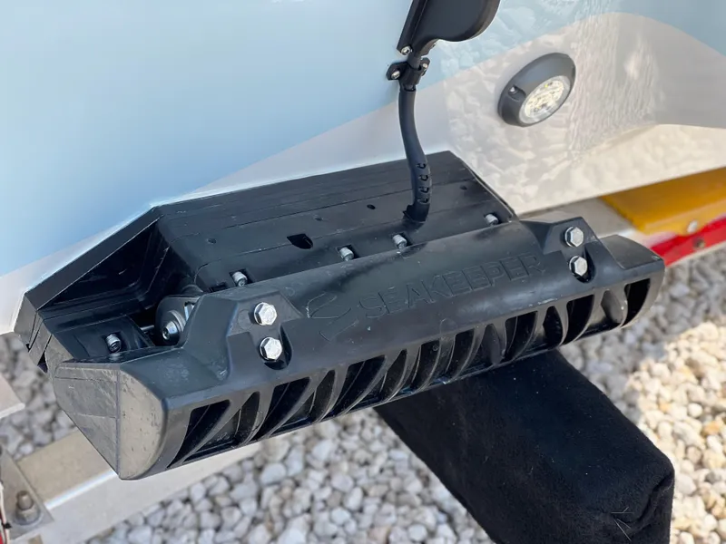 Slide: The Image of Key West 239FSR 2025 boat transducer mounted on hull, close-up view. - 10