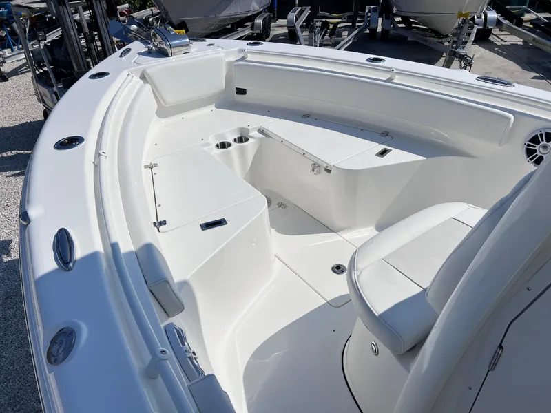 Slide: The Image of 2025 Key West 239FSR boat interior with seating and cup holders, showcasing modern design. - 11