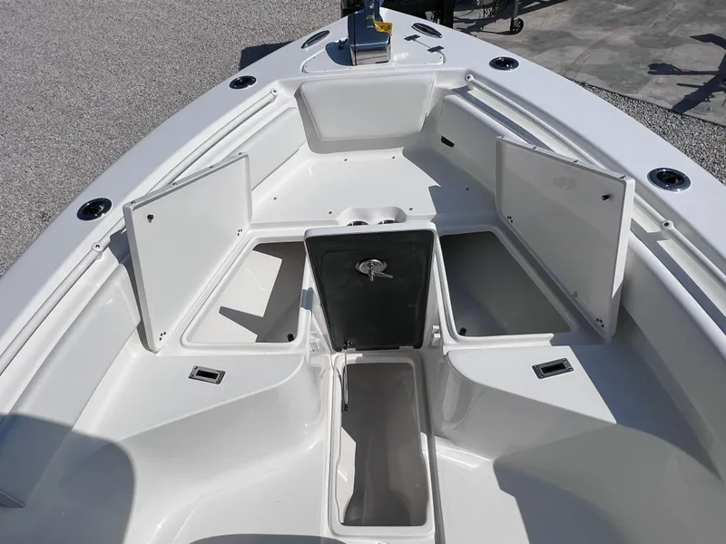 Slide: The Image of 2025 Key West 239FSR boat with open storage compartments on deck. - 13