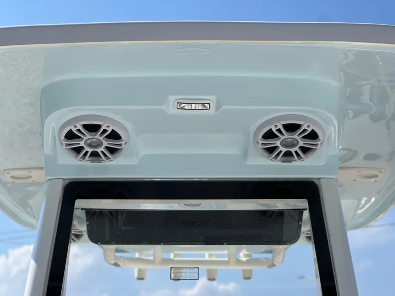 Slide: The Image of 2025 Key West 239FSR boat speakers and roof detail against blue sky. - 17