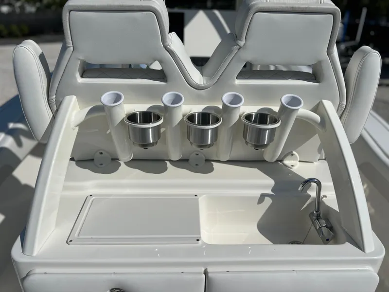 Slide: The Image of 2025 Key West 239FSR boat console with rod holders and cup holders. - 41