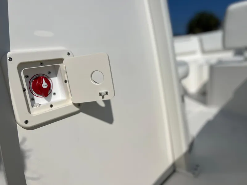 Slide: The Image of 2025 Key West 239FSR boat detail showing a red switch on a white panel. - 46