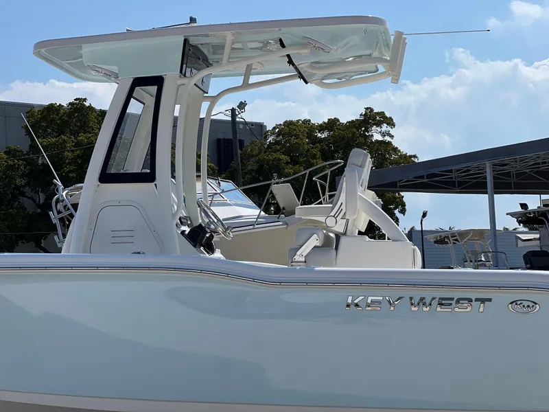 Slide: The Image of 2025 Key West 239FSR boat with sleek design and modern features, docked outdoors. - 5