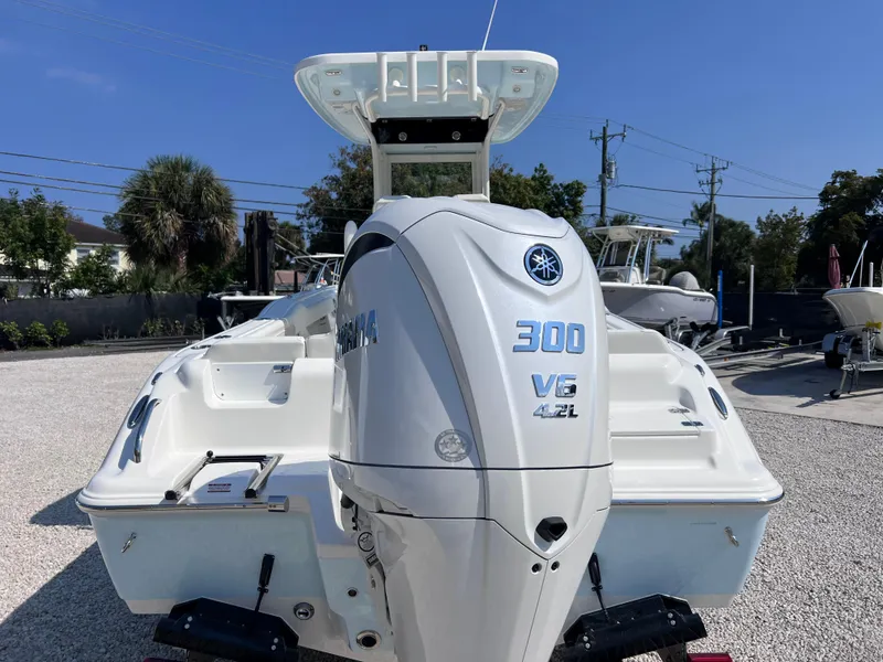 Slide: The Image of 2025 Key West 239FSR boat with Yamaha 300 V6 engine, displayed outdoors. - 7
