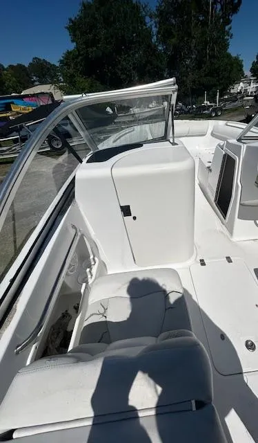 Slide: The Image of 2009 Edgewater 20 CX boat interior with white seating and windshield. - 5