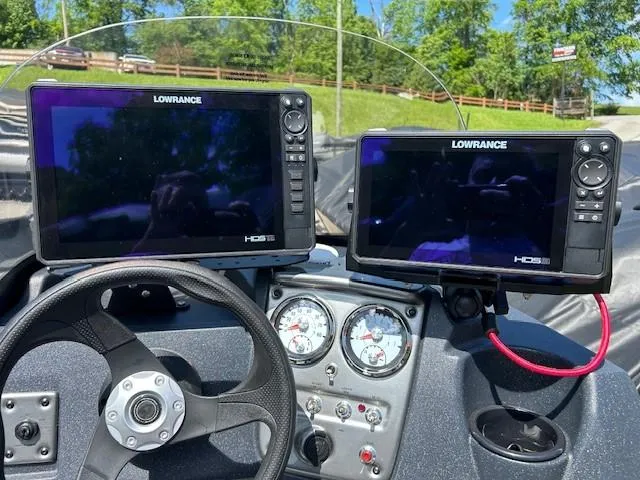 Slide: The Image of 2025 Tracker Pro Guide V-16 SC dashboard with Lowrance HDS displays and steering wheel. - 5