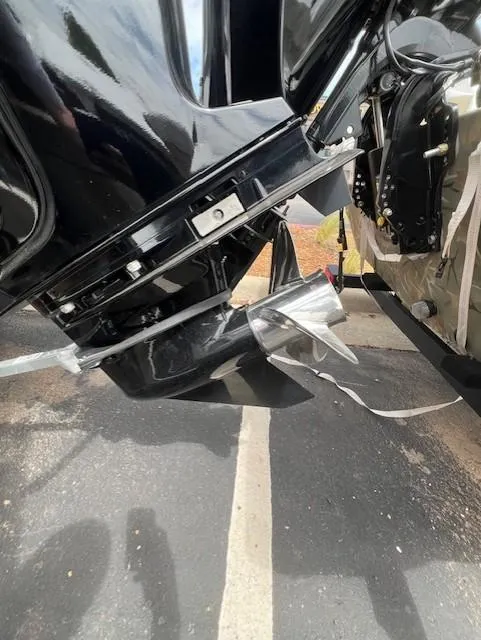 Slide: The Image of 2023 Tahoe T18 boat engine and propeller detail, parked on asphalt. - 13