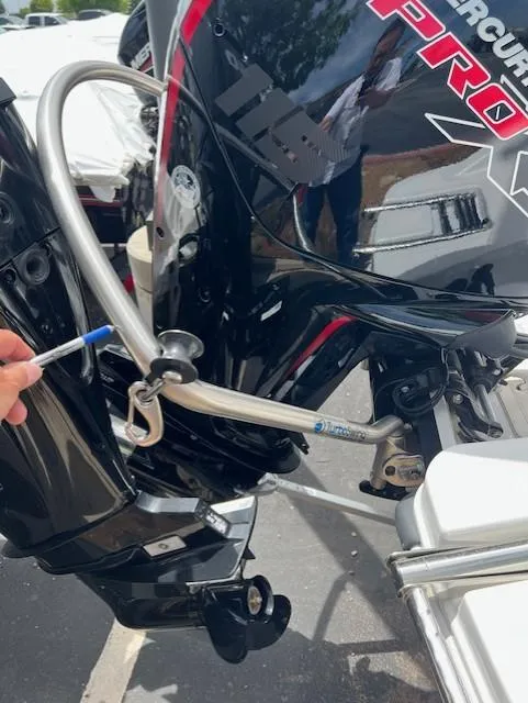 Slide: The Image of 2023 Tahoe T18 boat with Mercury Pro outboard motor, showing steering mechanism detail. - 5