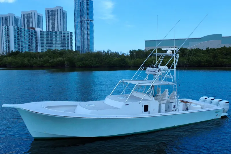 Slide: The Image of 2017 Chesapeake 53 Center Console boat on water with city skyline background. - 11