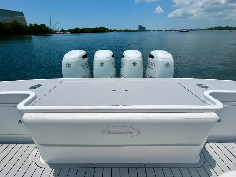 Slide: The Image of 2017 Chesapeake 53 Center Console boat with four Suzuki outboard engines on a calm waterway. - 16