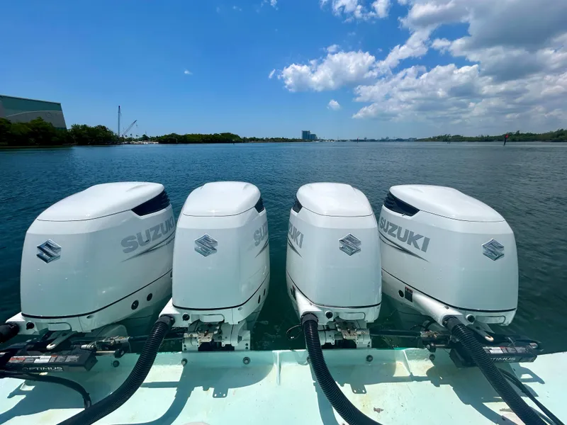 Slide: The Image of Four Suzuki outboard motors on a 2017 Chesapeake 53 Center Console boat, on a sunny day. - 18