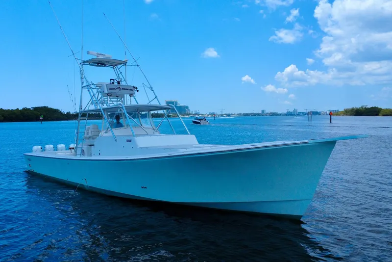 Slide: The Image of 2017 Chesapeake 53 Center Console boat on calm blue water under a clear sky. - 2