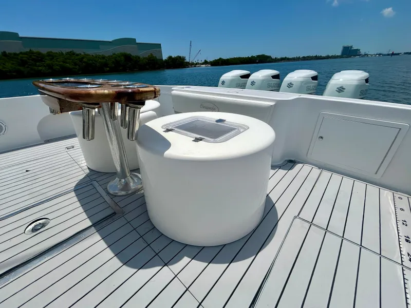 Slide: The Image of 2017 Chesapeake 53 Center Console boat deck with seating and multiple outboard engines. - 20