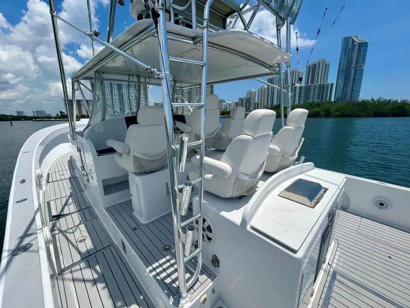 Slide: The Image of 2017 Chesapeake 53 Center Console boat with white seating, city skyline in background. - 29