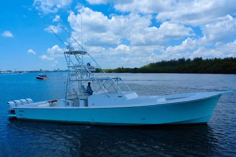 Slide: The Image of 2017 Chesapeake 53 Center Console boat on calm water under a partly cloudy sky. - 3