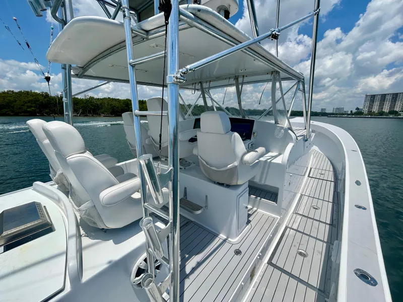 Slide: The Image of 2017 Chesapeake 53 Center Console boat with sleek design and modern seating on open water. - 31