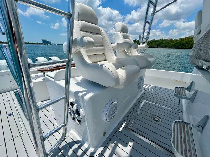 Slide: The Image of Luxurious seating on 2017 Chesapeake 53 Center Console boat, with ocean view and clear skies. - 32