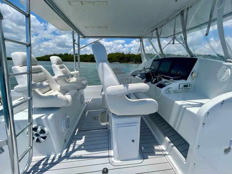 Slide: The Image of 2017 Chesapeake 53 Center Console boat interior with helm, seats, and navigation equipment. - 34