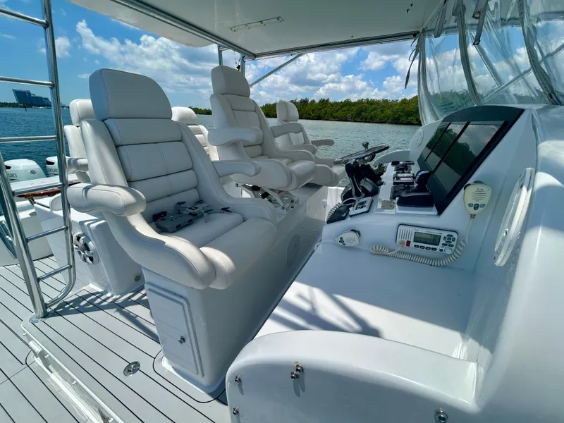 Slide: The Image of Luxurious 2017 Chesapeake 53 Center Console boat interior with plush seating and advanced controls. - 36