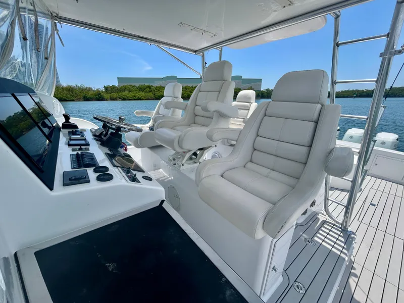 Slide: The Image of 2017 Chesapeake 53 Center Console interior with luxurious white seating and advanced control panel. - 37