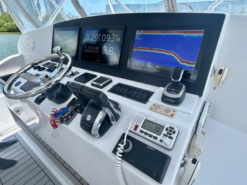 Slide: The Image of Control panel of 2017 Chesapeake 53 Center Console with navigation screens and instruments. - 39