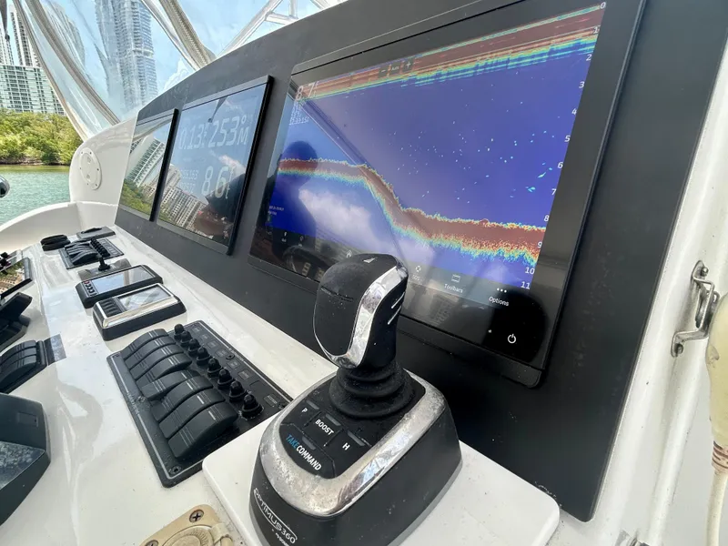 Slide: The Image of 2017 Chesapeake 53 Center Console dashboard with navigation screens and controls. - 42