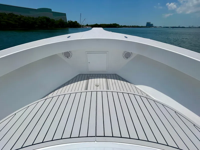 Slide: The Image of 2017 Chesapeake 53 Center Console boat deck with sleek design on calm water. - 48