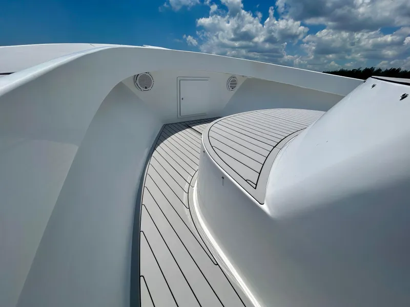 Slide: The Image of 2017 Chesapeake 53 Center Console boat deck under a blue sky with clouds. - 49