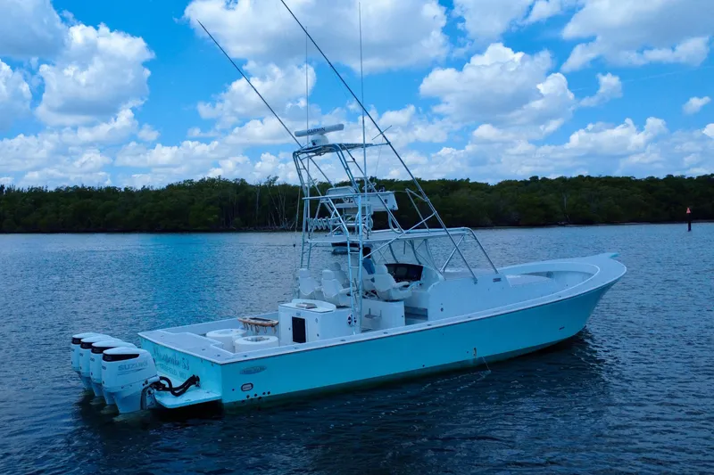 Slide: The Image of 2017 Chesapeake 53 Center Console boat on calm water under a blue sky. - 5
