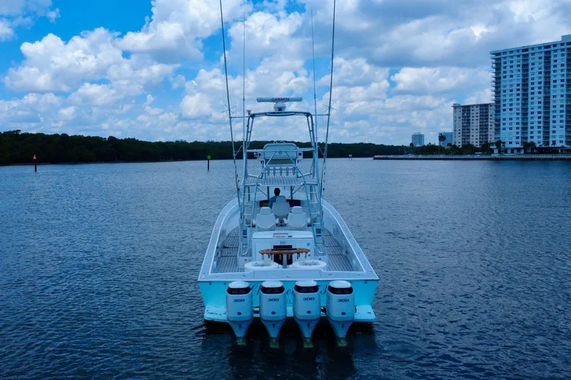Slide: The Image of 2017 Chesapeake 53 Center Console boat on calm water, cityscape in background. - 7