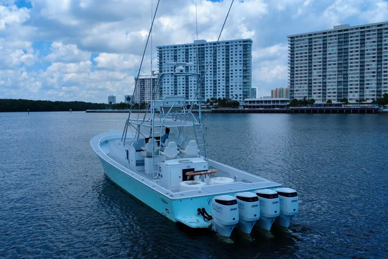Slide: The Image of 2017 Chesapeake 53 Center Console boat on water with city skyline background. - 8