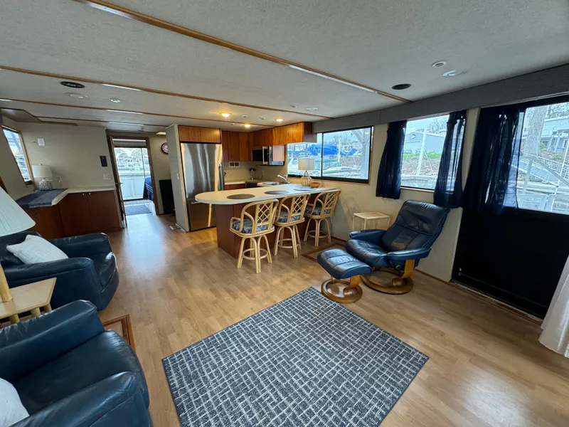 Slide: The Image of Interior of a 1996 Skipperliner 560 Coastal Cruiser with modern kitchen and seating area. - 11
