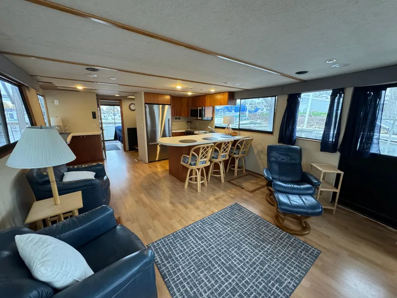 Slide: The Image of Spacious interior of 1996 Skipperliner 560 Coastal Cruiser with modern kitchen and seating area. - 12