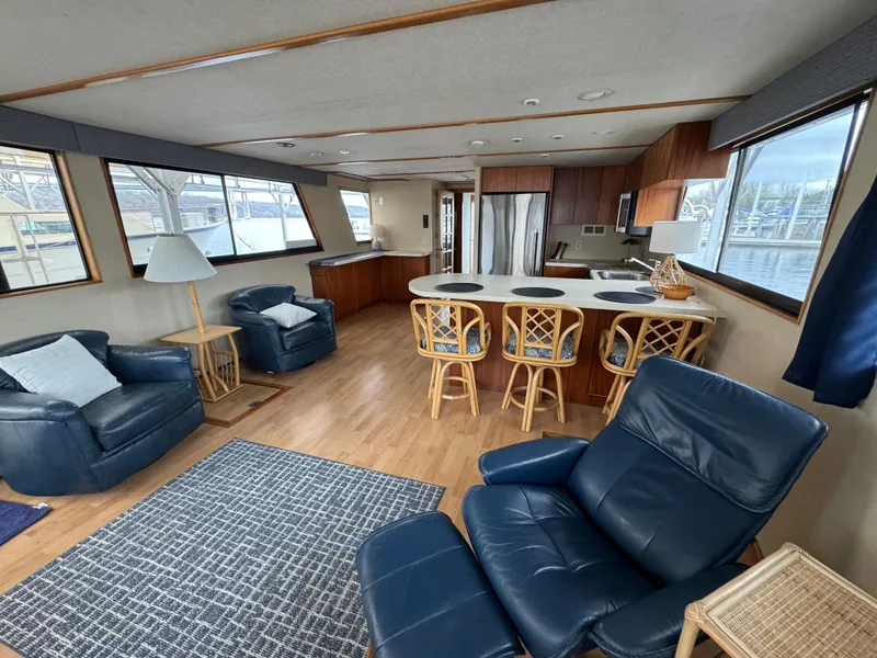Slide: The Image of Spacious interior of 1996 Skipperliner 560 Coastal Cruiser with modern kitchen and seating area. - 16