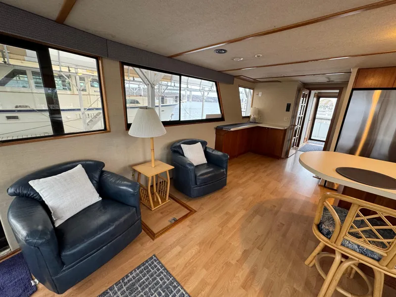Slide: The Image of Interior of a 1996 Skipperliner 560 Coastal Cruiser with modern furnishings and large windows. - 17