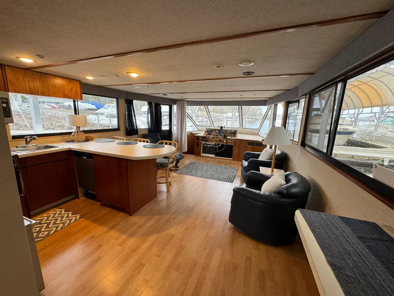 Slide: The Image of Interior of 1996 Skipperliner 560 Coastal Cruiser with modern kitchen and seating area. - 19