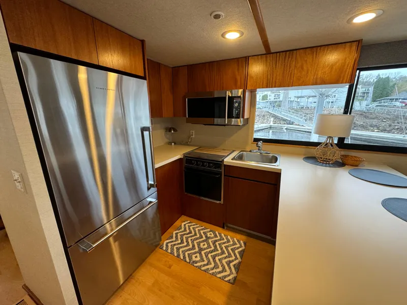 Slide: The Image of Modern kitchen in 1996 Skipperliner 560 Coastal Cruiser with stainless steel appliances. - 21