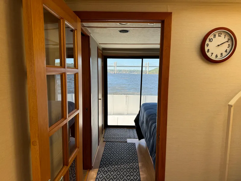 Slide: The Image of Interior of 1996 Skipperliner 560 Coastal Cruiser with bedroom and lake view. - 26