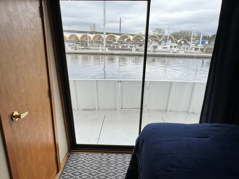 Slide: The Image of Interior view of 1996 Skipperliner 560 Coastal Cruiser with marina backdrop. - 30