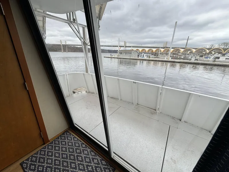 Slide: The Image of 1996 Skipperliner 560 Coastal Cruiser deck view with marina backdrop. - 31