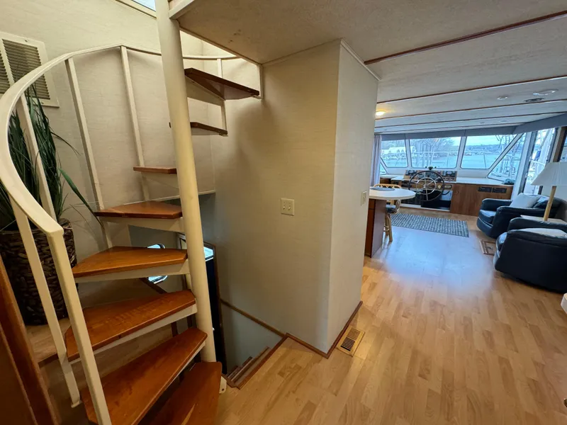 Slide: The Image of Interior of 1996 Skipperliner 560 Coastal Cruiser with spiral staircase and spacious living area. - 40
