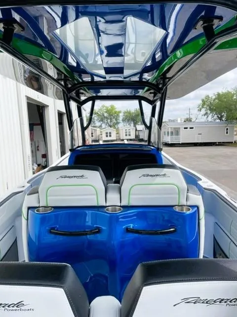 Slide: The Image of 2025 Renegade 38 Open boat interior with sleek blue and white seating and modern design. - 11