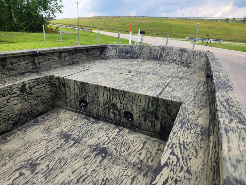 Slide: The Image of 2025 Tracker Grizzly 1650 T Prairie Wings Edition boat with camouflage interior design. - 10