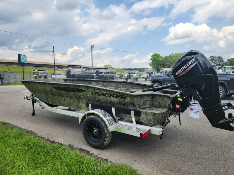 Slide: The Image of 2025 Tracker Grizzly 1650 T Prairie Wings Edition boat with Mercury engine on trailer. - 4
