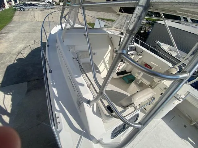 Slide: The Image of 2001 Boston Whaler 28 Conquest boat deck with seating and railing. - 26