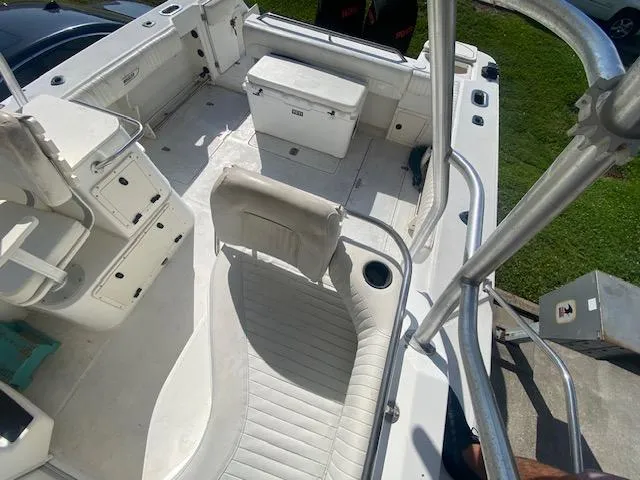 Slide: The Image of 2001 Boston Whaler 28 Conquest boat interior with seating and storage compartments. - 29
