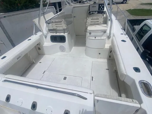 Slide: The Image of 2001 Boston Whaler 28 Conquest boat interior with dual seats and spacious deck. - 38