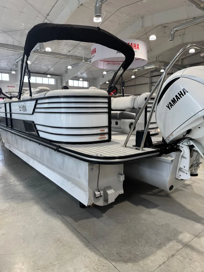 Slide: The Image of 2024 G3 Elite 324RC pontoon boat with Yamaha engine in showroom. - 1